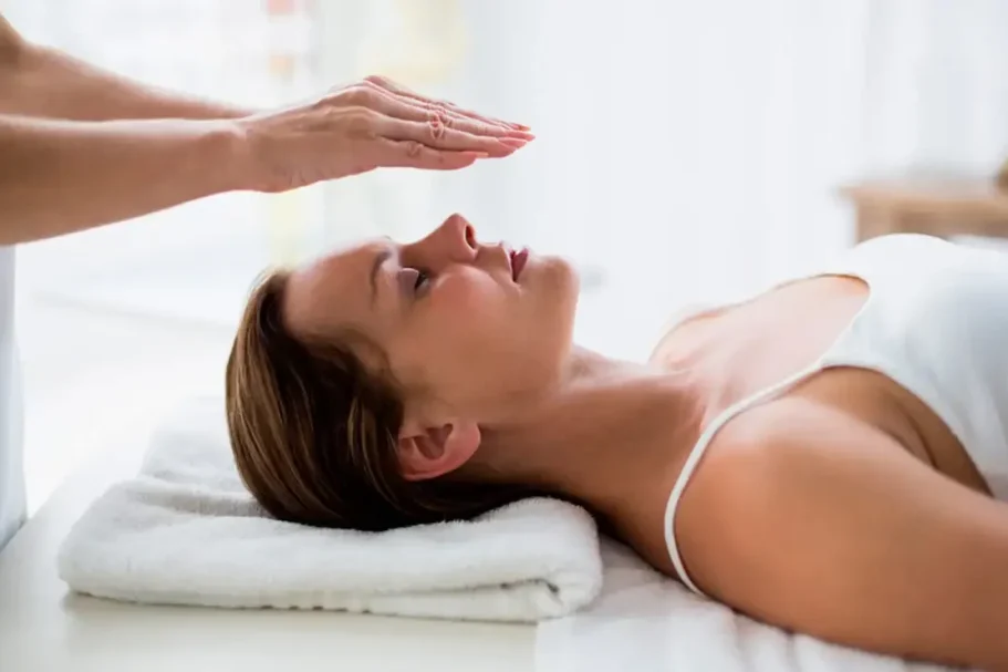 Woman receiving a wellness treatment in a relaxing environment.