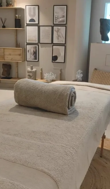 Massage at Home in Benahavis with SENSE8 Massage table with rolled-up towel and minimalist décor in the background.