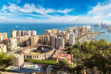 Panoramic view of Malaga, with the port and bullring in the foreground